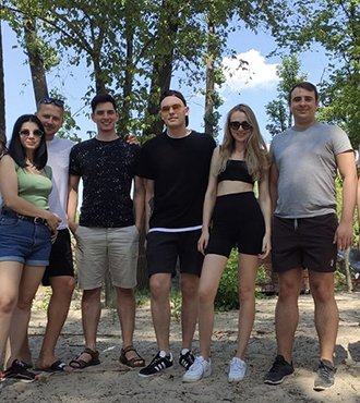 Our diverse team at Evadav working together on cutting-edge technology projects