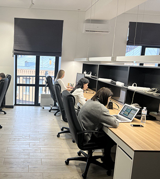 Our diverse team at Evadav working together on cutting-edge technology projects